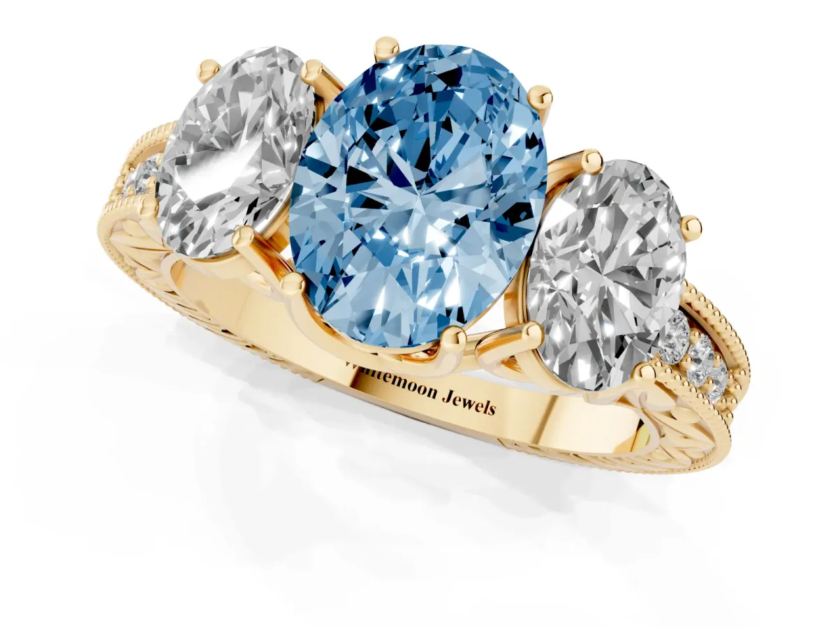 Fancy Blue Three-Stone Oval Cut Cut Milgrain Pavé Engagement Ring Yellow gold