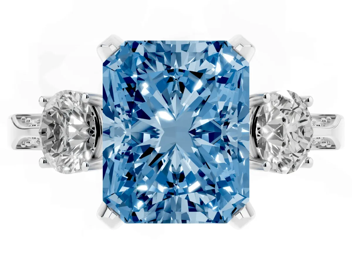 Fancy Blue Radiant Cut Brilliant Three-Stone Diamond Ring with Pavé Band and Four-Prong Setting Silver