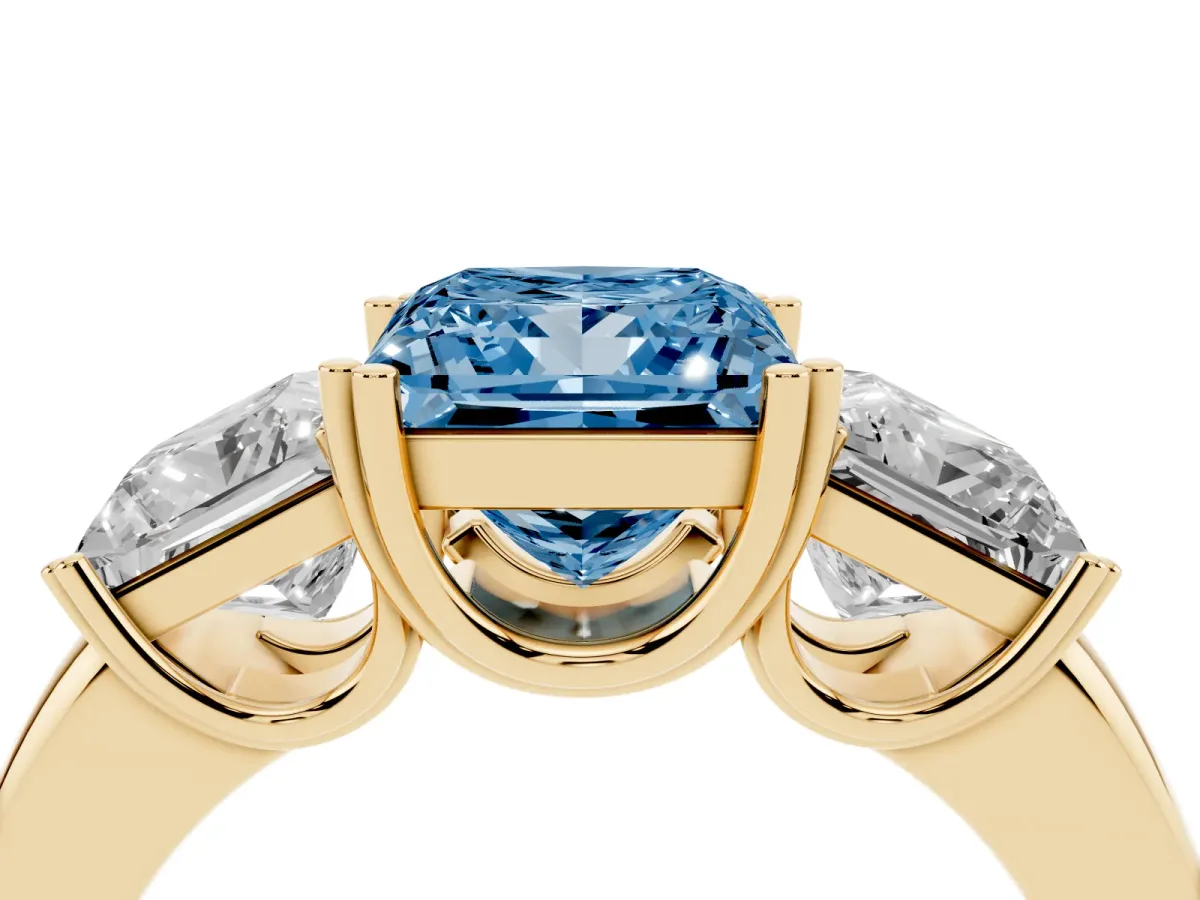 Fancy Blue Three-Stone Princess Cut Cut Diamond Ring with Channel Set Band and Four-Prong Setting Yellow gold
