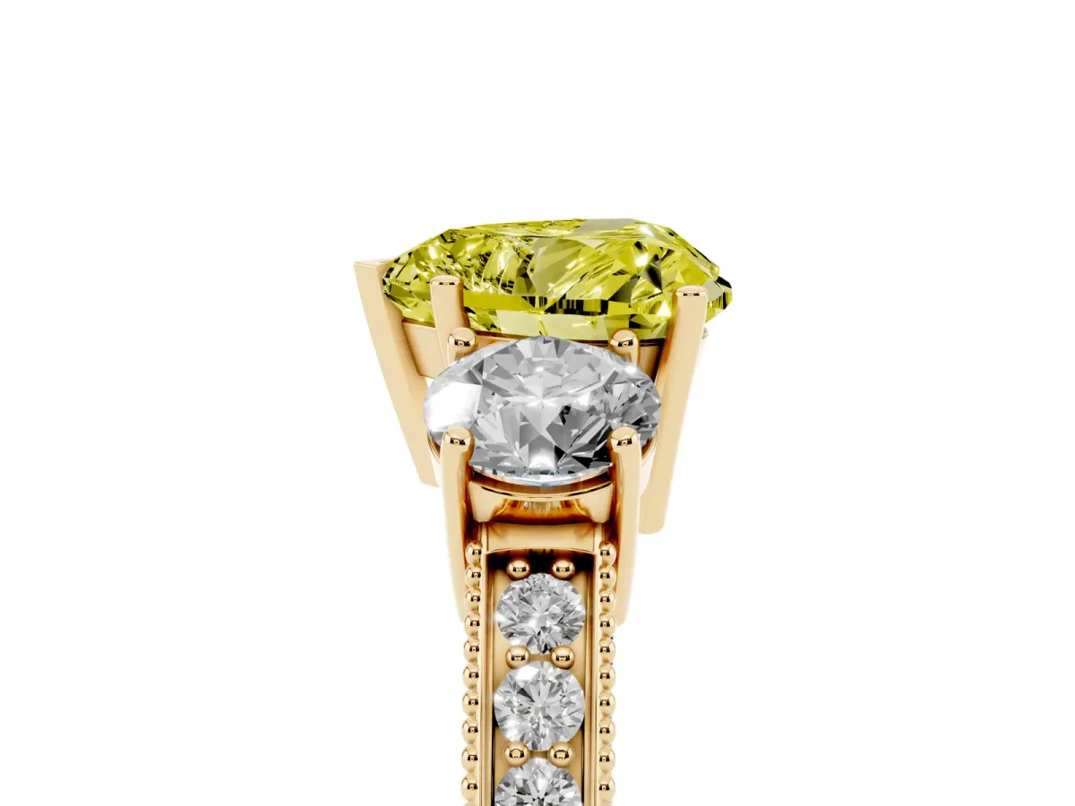 Fancy Yellow Heart Cut Three-Stone Diamond Ring with Pavé Band and Four-Prong Setting Yellow gold