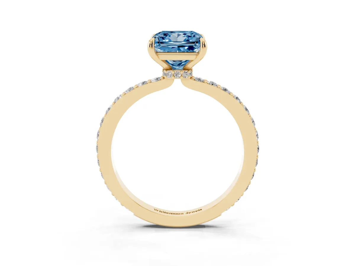 Fancy Blue Princess Cut Diamond Pavé Engagement Ring with Round Accents and Prong Setting Yellow gold