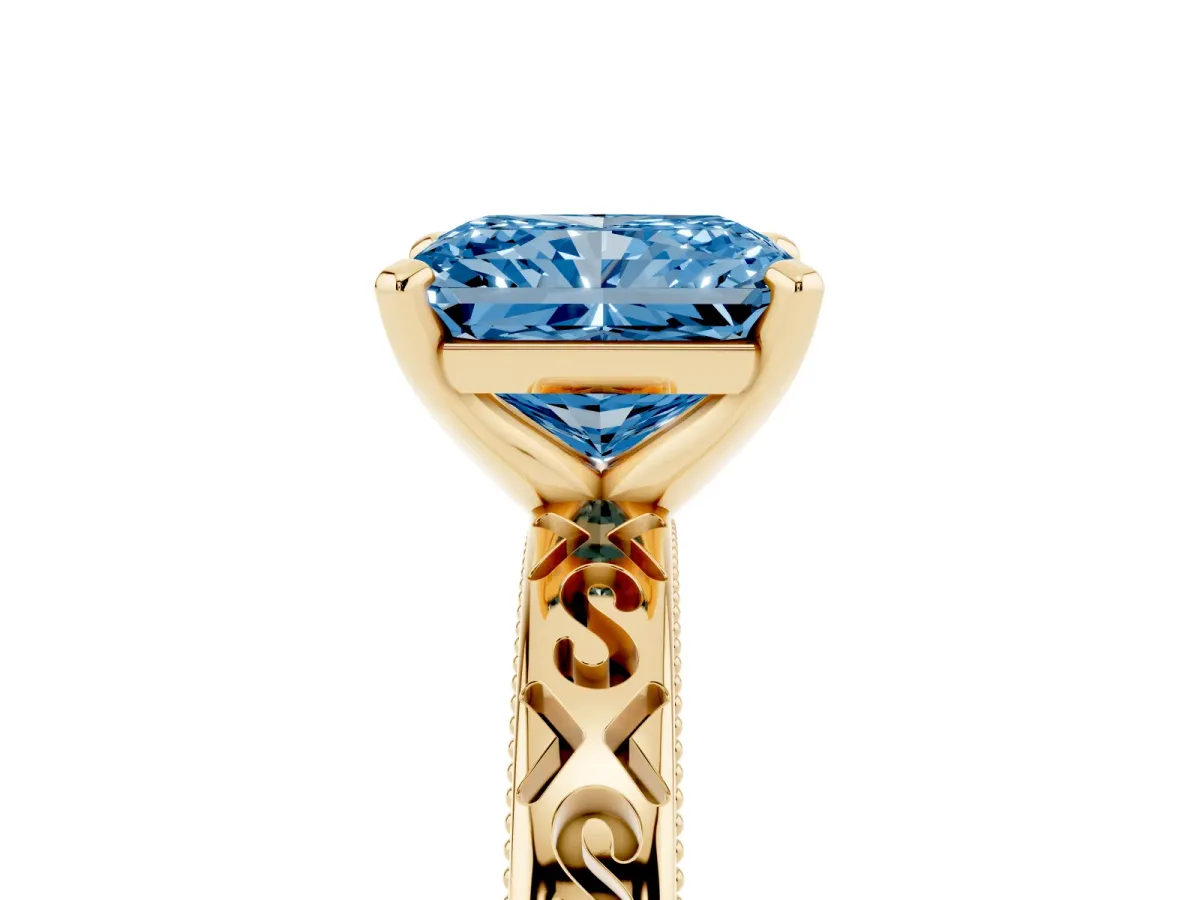 Fancy Blue Radiant Cut Solitaire Engagement Ring with Scrollwork Band and Four-Prong Setting Yellow gold