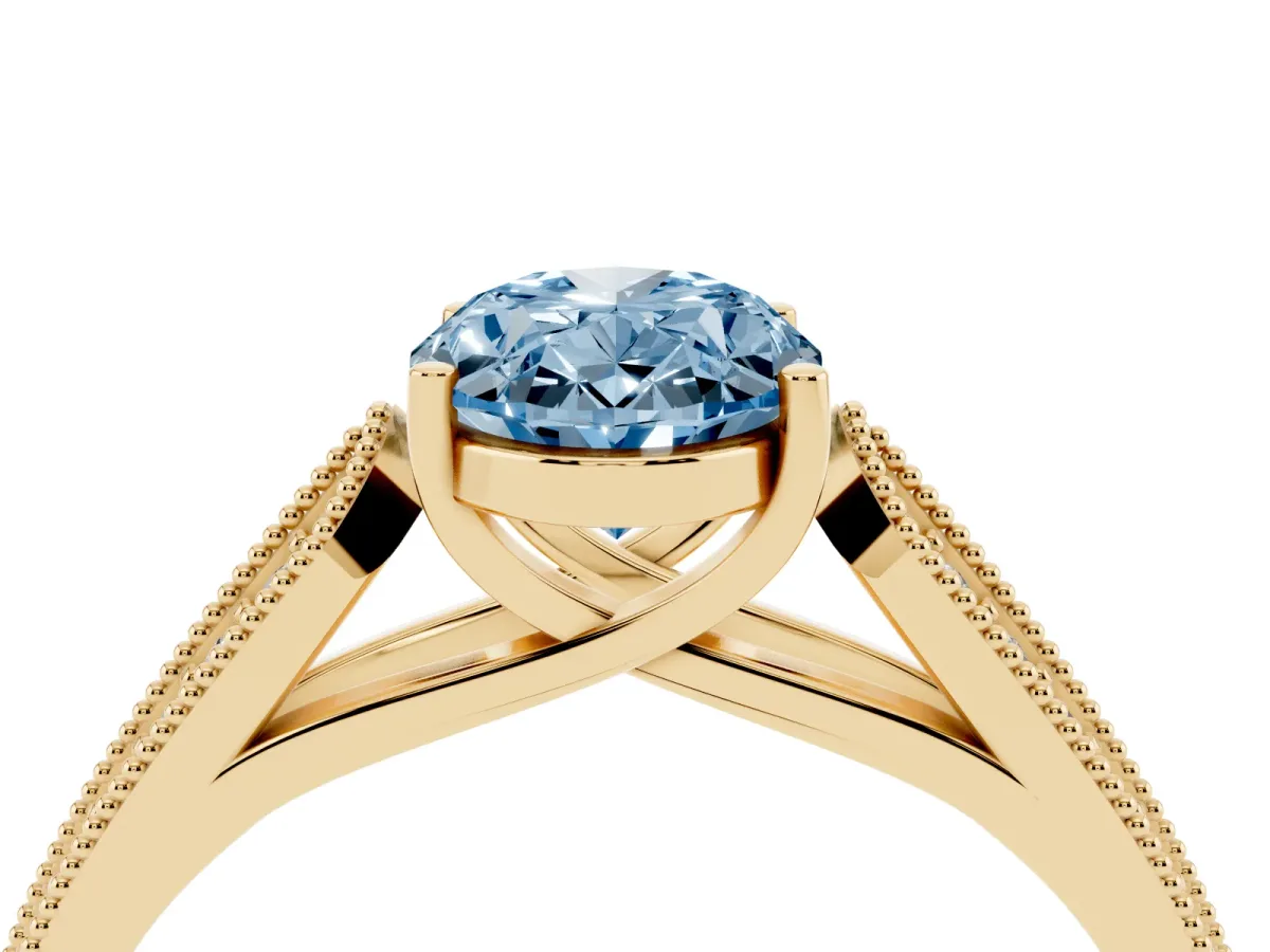 Fancy Blue Oval Cut Cut Pave Split Shank Engagement Ring with Four-Prong Setting Yellow gold