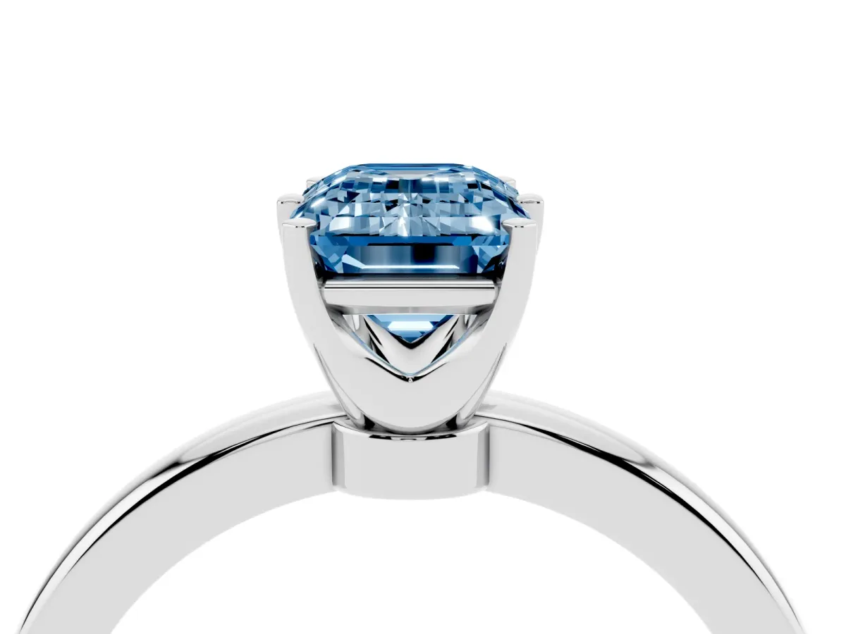Fancy Blue Emerald Cut Solitaire Diamond Ring with Six-Prong Setting on a Classic Band Platinum