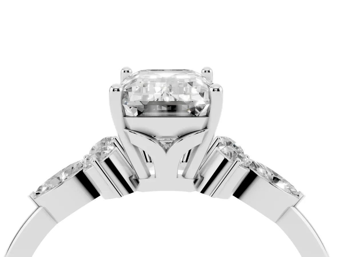 Emerald Cut Brilliant Diamond Solitaire Ring with Pear Side Stones and Four-Prong Setting Silver