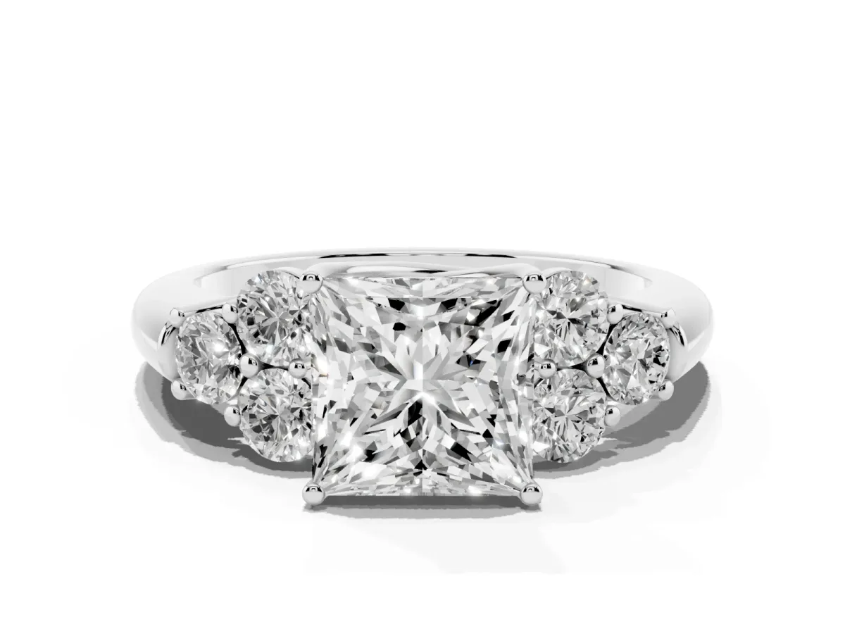 Princess Cut Cut Diamond Cluster Ring with Round Accent Stones and Prong Setting on a Classic Band White gold