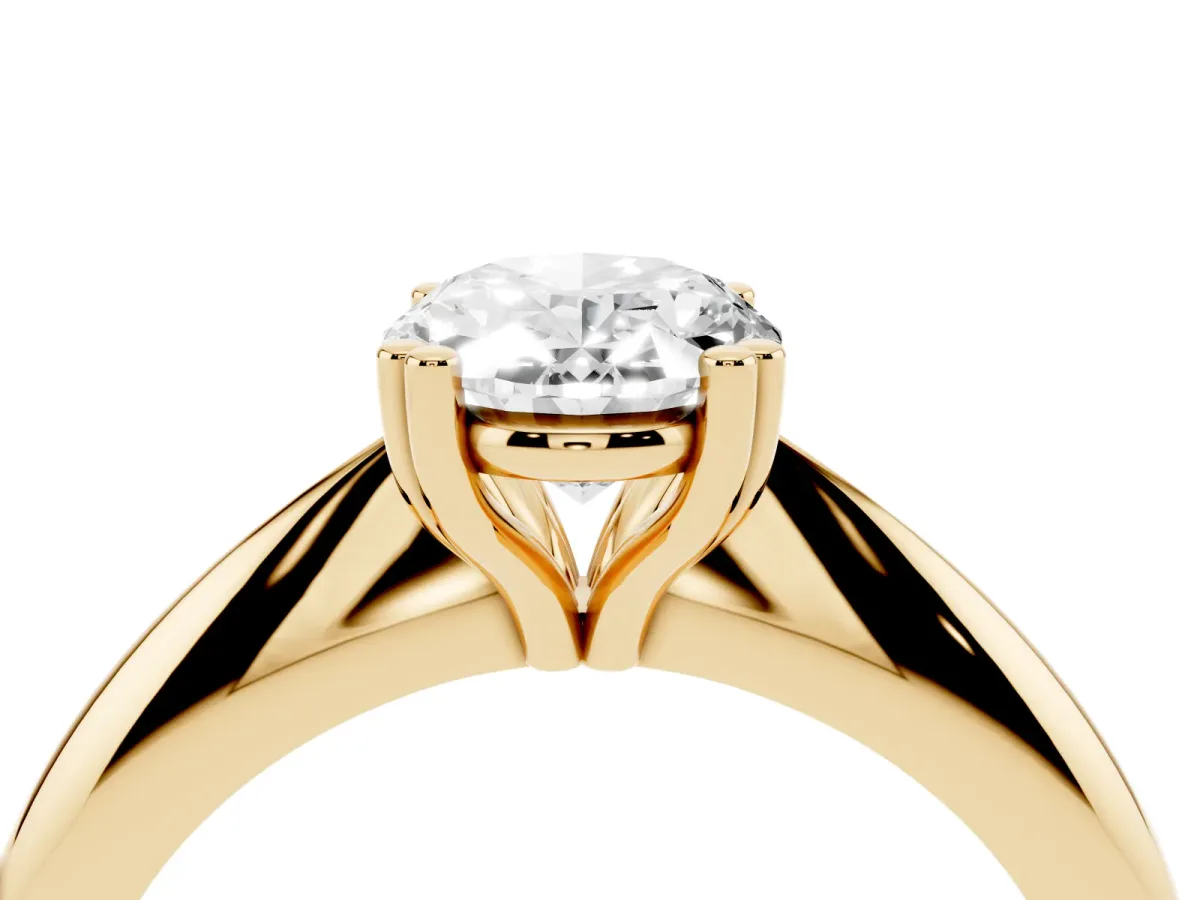 Oval Cut Cut Solitaire Engagement Ring with Tapered Band and Four-Prong Setting Yellow gold