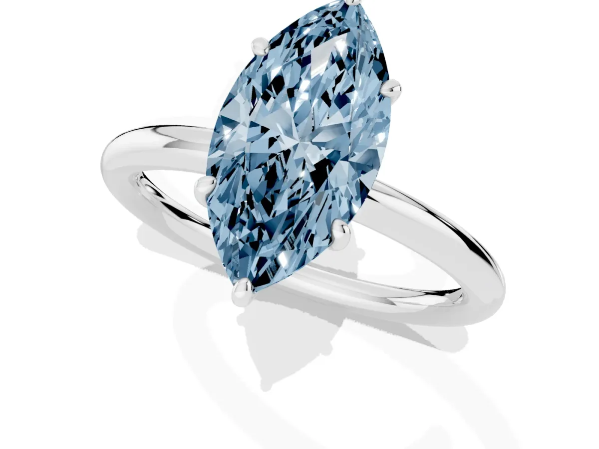 Fancy Blue Marquise Cut Solitaire Diamond Ring with Four-Prong Setting on a Plain Band Silver
