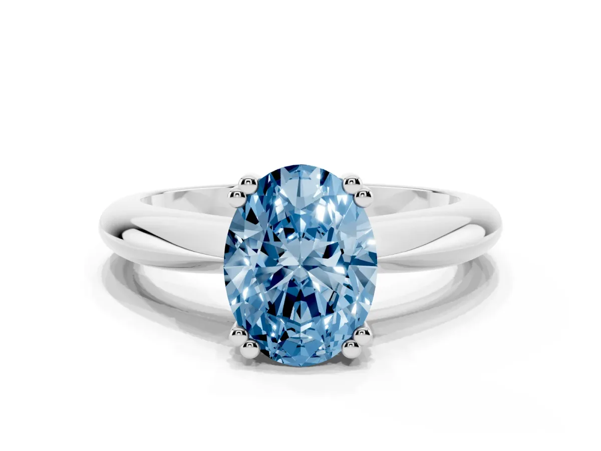 Fancy Blue Oval Cut Cut Solitaire Engagement Ring with Tapered Band and Four-Prong Setting Silver