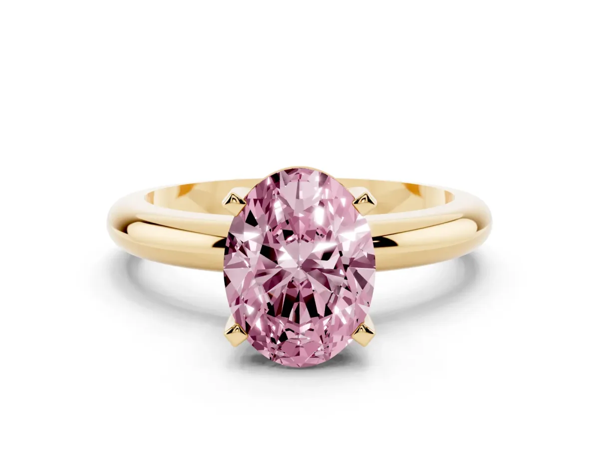 Fancy Pink Oval Cut Diamond Solitaire Engagement Ring with Round Band and Four-Prong Setting Yellow gold