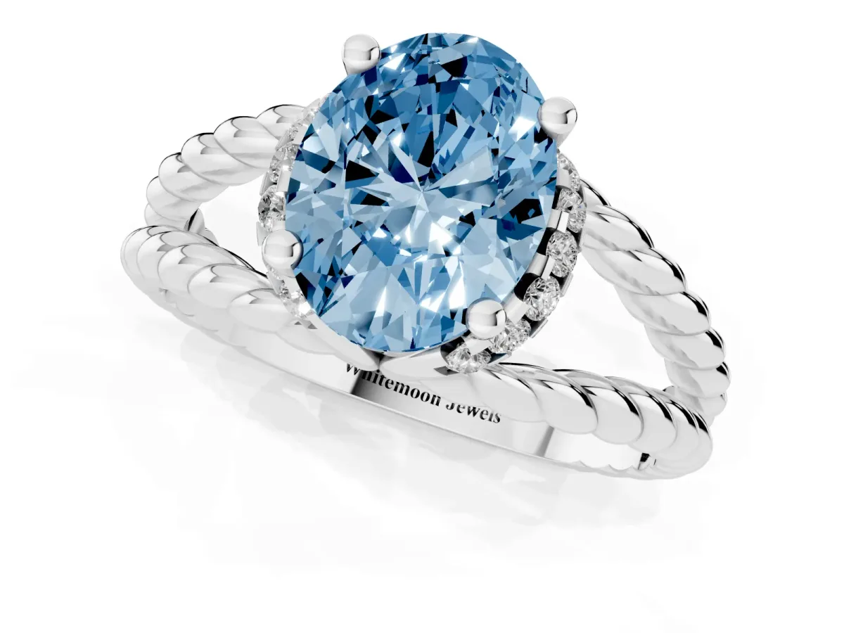 Fancy Blue Oval Cut Halo Twisted Band Four-Prong Ring Silver