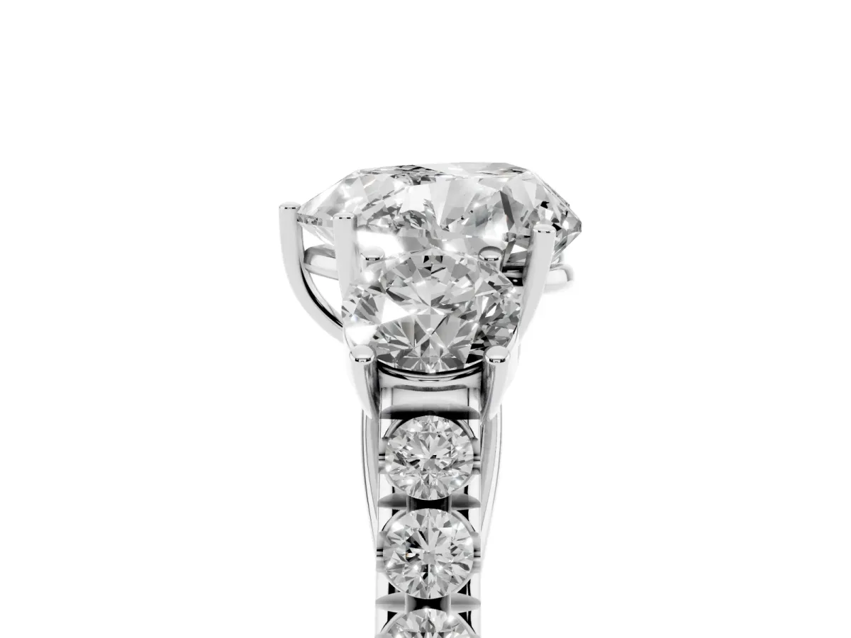 Heart Cut Cut Diamond Three-Stone Ring with Round Side Stones and Pavé Band Silver