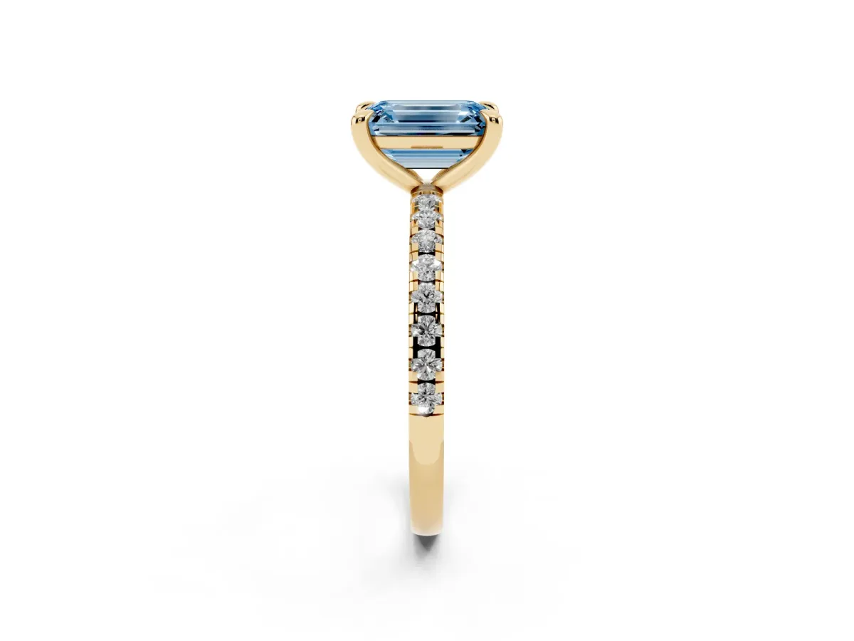 Fancy Blue Emerald Cut Diamond Brilliant Solitaire Ring with Pavé Band and Four-Prong Setting Yellow gold