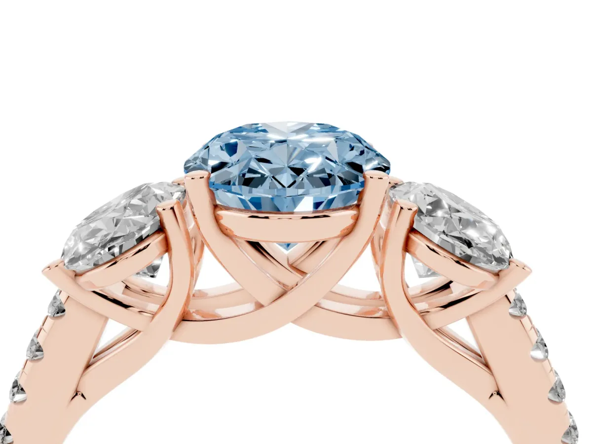Fancy Blue Three-Stone Oval Cut Diamond Ring with Round Pavé Band and Prong Setting Rose gold