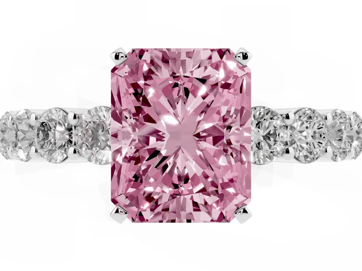 Fancy Pink Radiant Cut Diamond Solitaire Ring with Shared Prong Round Side Stones Platinum