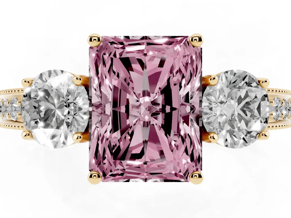 Fancy Pink Radiant Cut Three-Stone Diamond Ring with Pavé Band and Four-Prong Setting Yellow gold