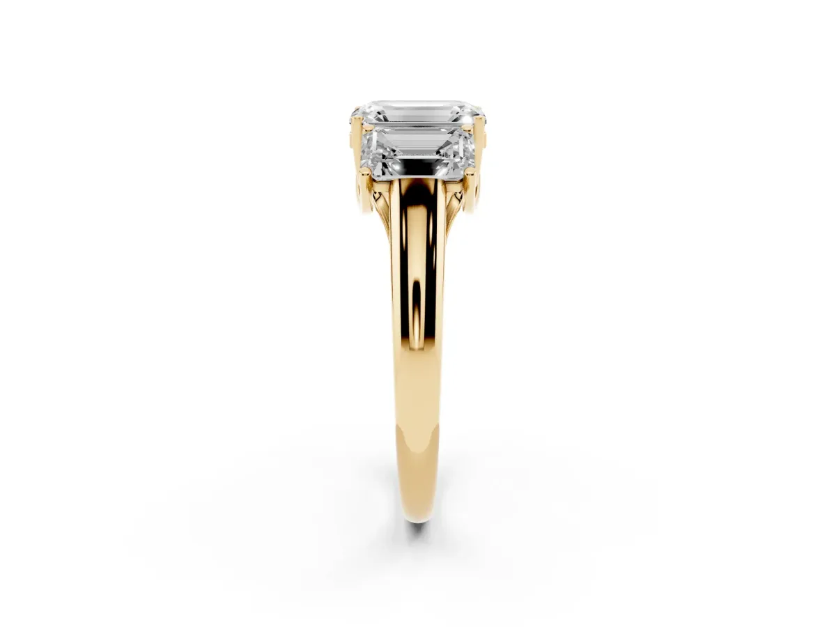 Three-Stone Emerald Cut Diamond Engagement Ring with Prong Setting Yellow gold
