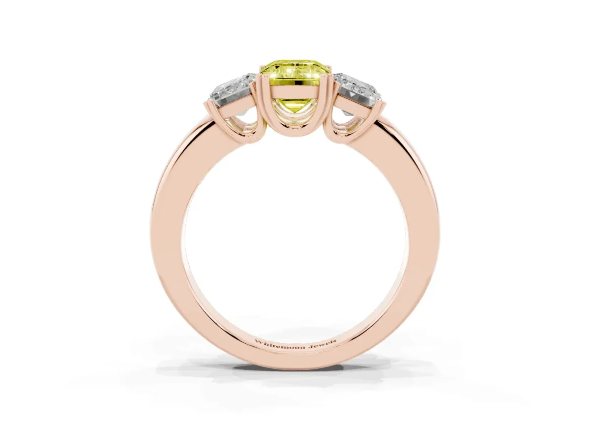 Fancy Yellow Three-Stone Emerald Cut Cut Diamond Ring with Channel Set Band and Four-Prong Setting Rose gold