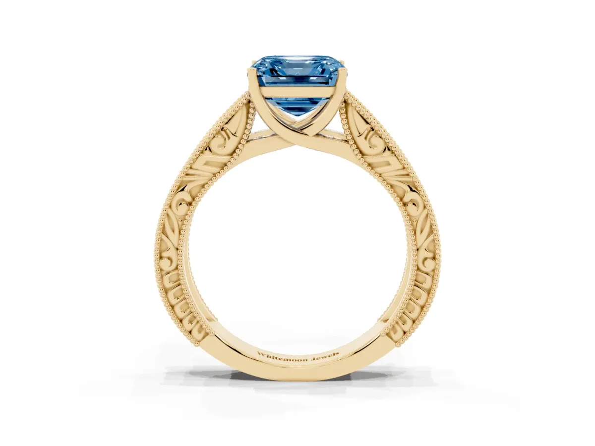 Fancy Blue Asscher Cut Diamond Solitaire Ring with Engraved Band and Four-Prong Setting Yellow gold