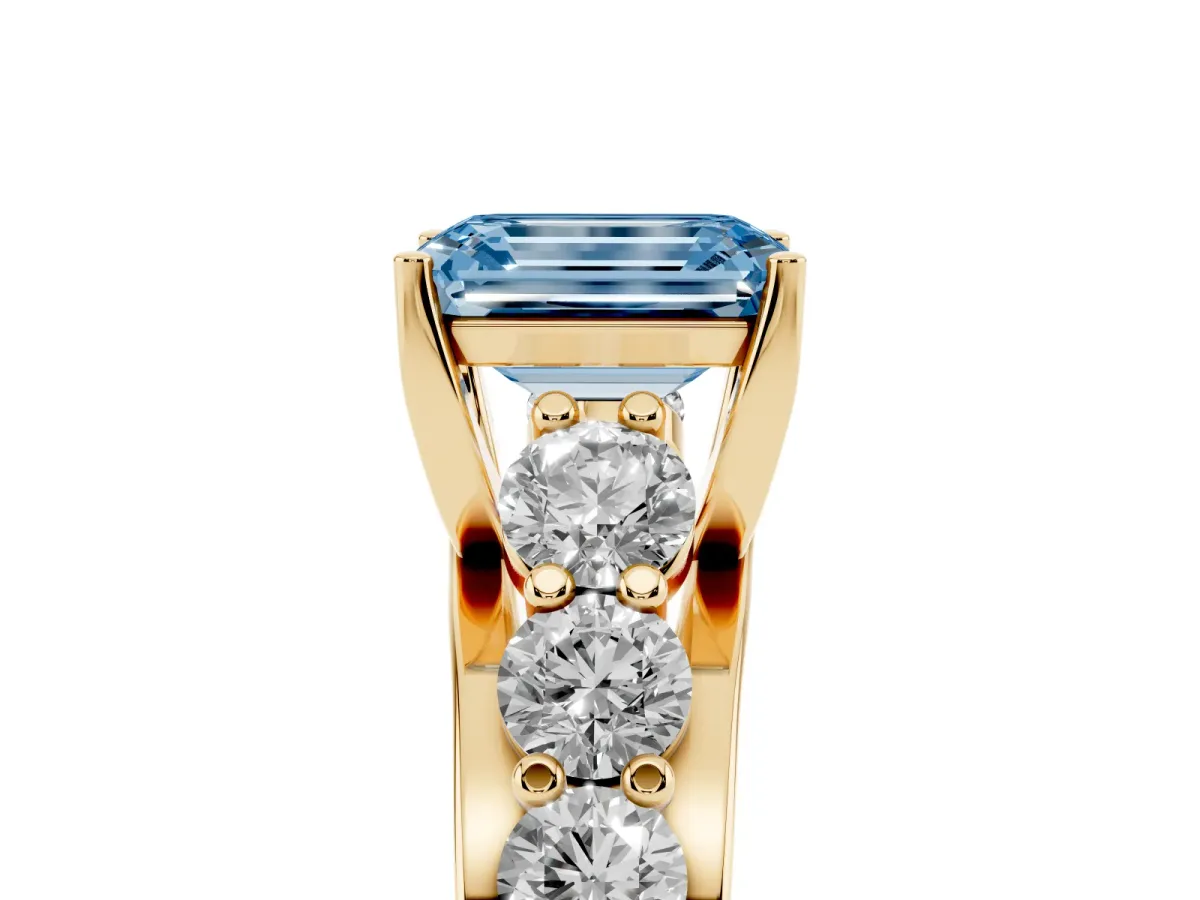 Fancy Blue Emerald Cut Diamond Engagement Ring with Pavé Band and Four-Prong Setting Yellow gold