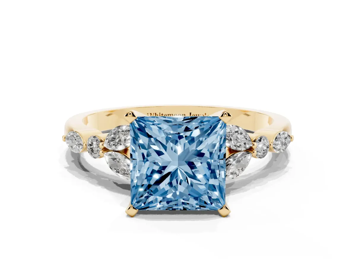 Fancy Blue Princess Cut Diamond Solitaire Ring with Side Stones and Four-Prong Setting Yellow gold