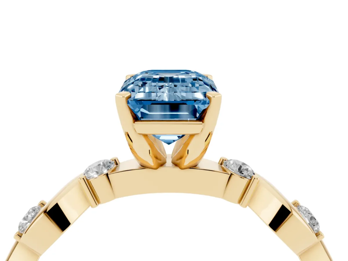 Fancy Blue Emerald Cut Diamond Solitaire Twisted Band with Round Accents and Prong Setting Yellow gold