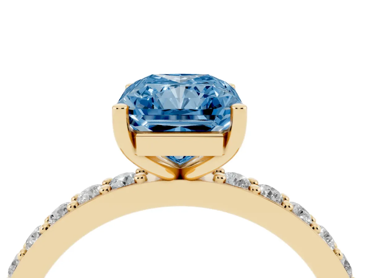 Fancy Blue Radiant Cut Cut Diamond Solitaire with Pave Band and Four-Prong Setting Yellow gold