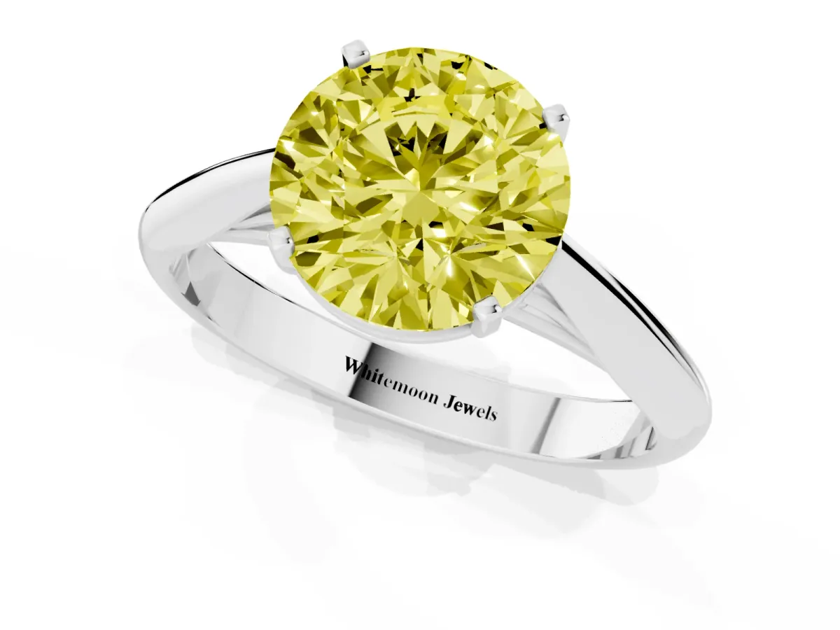 Fancy Yellow Round Cut Diamond Solitaire Engagement Ring with Cathedral Setting and Four-Prong Mount Silver