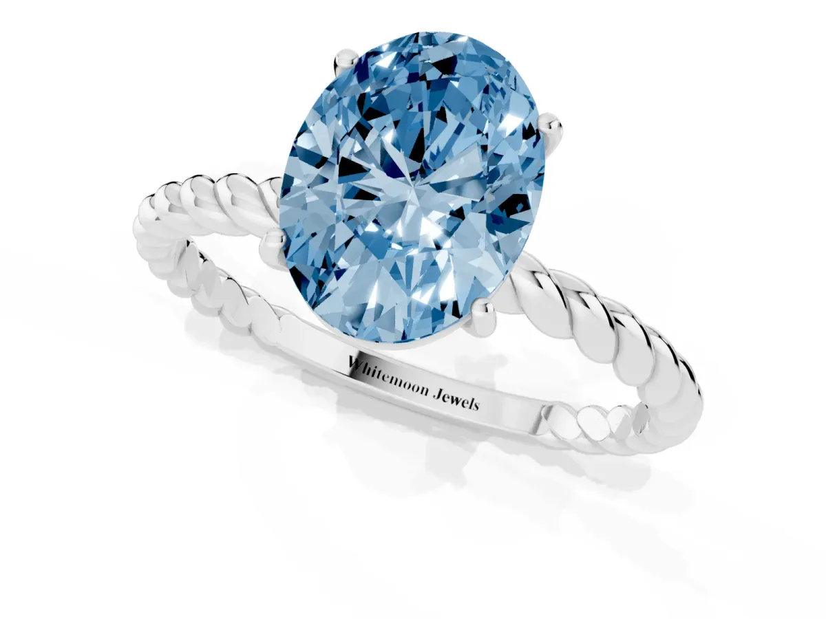 Fancy Blue Oval Cut Solitaire Twist Band Ring with Four-Prong Setting White gold