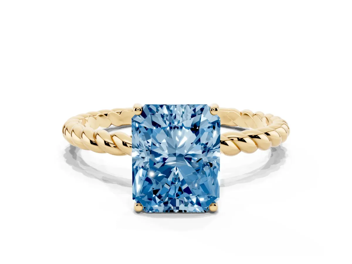 Fancy Blue Radiant Cut Solitaire Twist Band Ring with Four-Prong Setting Yellow gold