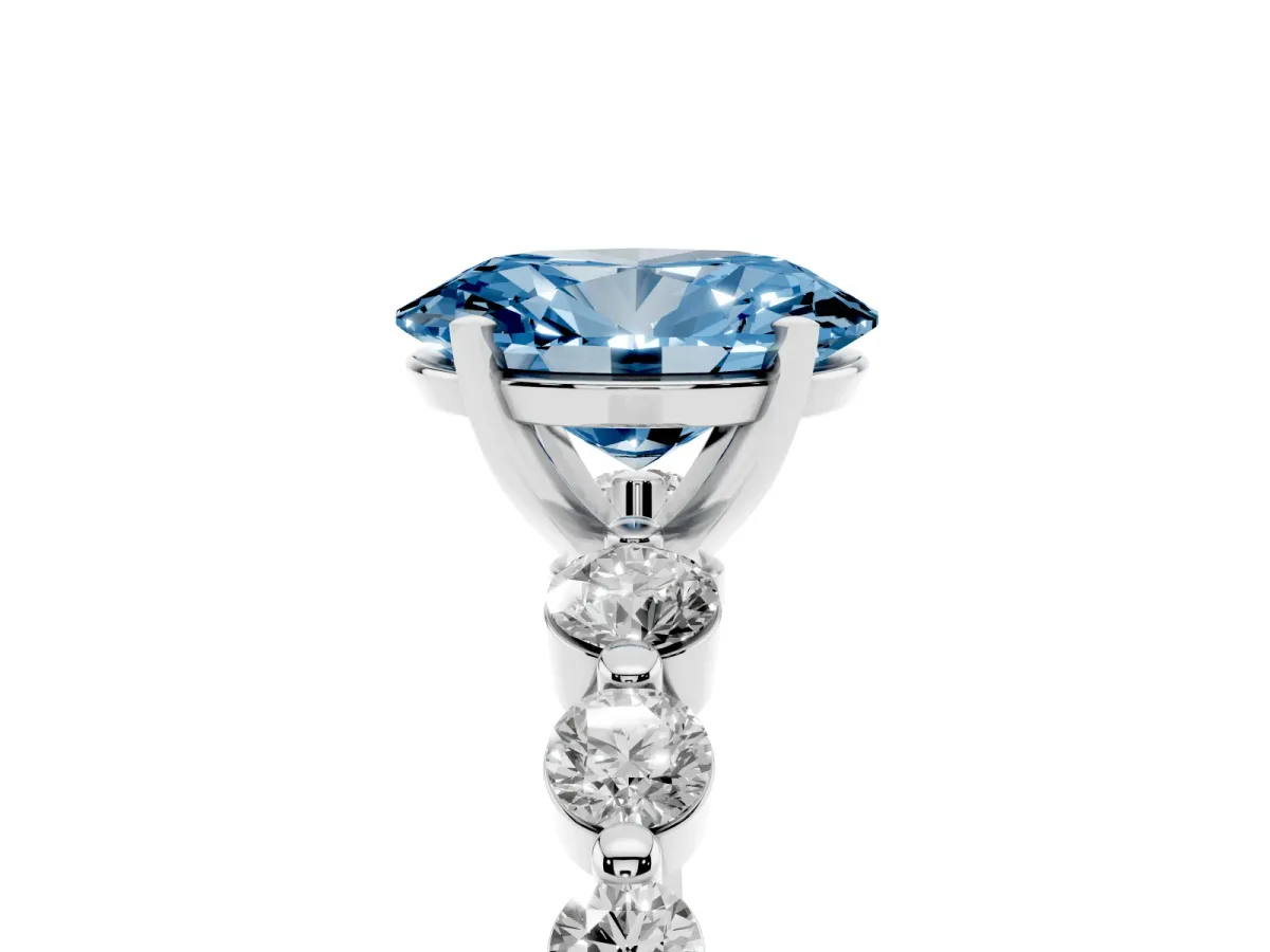 Fancy Blue Oval Cut Solitaire Diamond Ring with Pave Band and Four-Prong Setting Silver