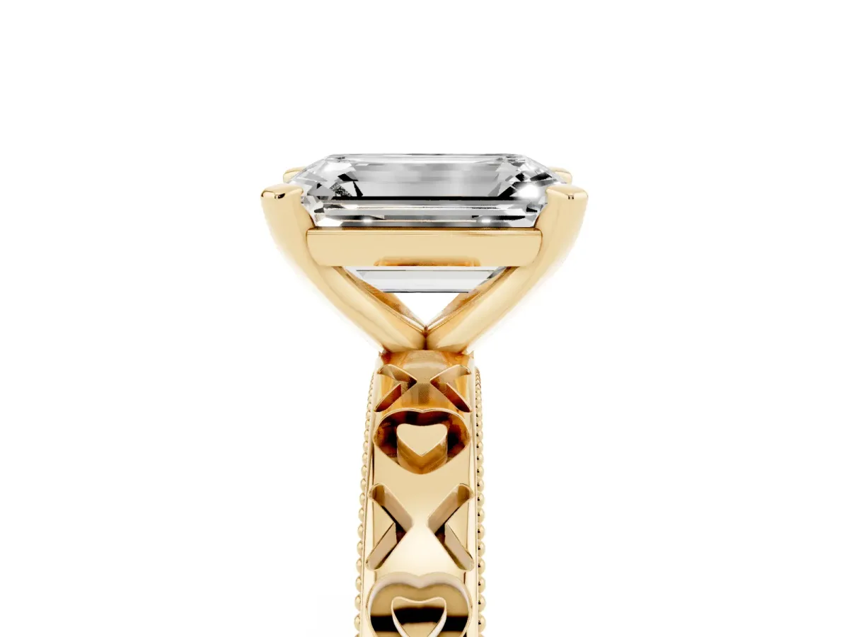 Emerald Cut Solitaire Diamond Engagement Ring with XO Engraved Band and Four-Prong Setting Yellow gold