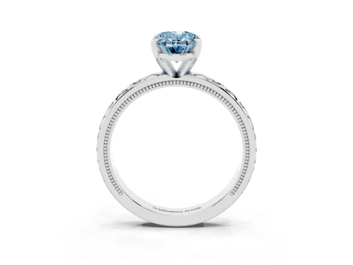 Fancy Blue Oval Cut Solitaire Diamond Engagement Ring with XO Engraved Band and Four-Prong Setting Silver