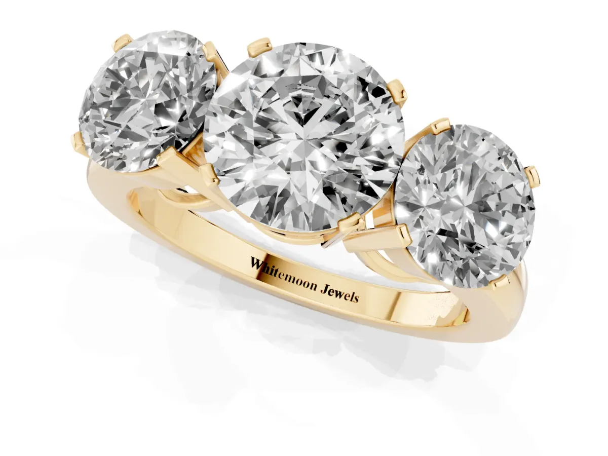 Three-Stone Round Cut Cut Diamond Ring with Channel Set Band and Four-Prong Setting Yellow gold