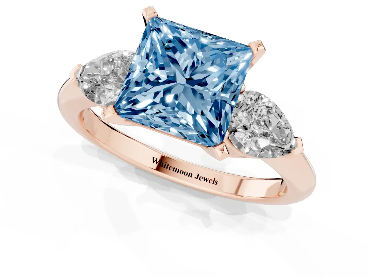 Fancy Blue Three-Stone Princess Cut Diamond Ring with Pear Side Stones and Four-Prong Setting Rose gold