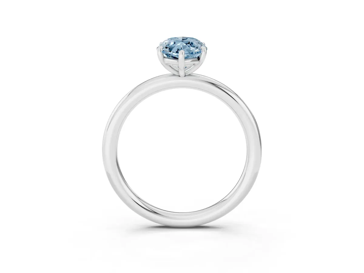 Fancy Blue Oval Cut Solitaire Diamond Ring with Four-Prong Setting on a Plain Band Platinum