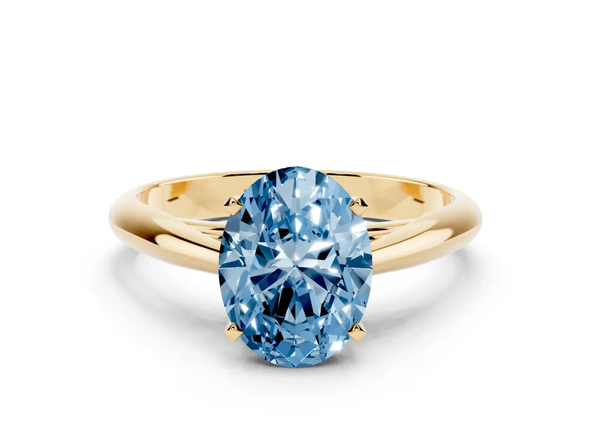 Fancy Blue Oval Cut Diamond Solitaire Engagement Ring with Cathedral Setting and Four-Prong Mount Yellow gold