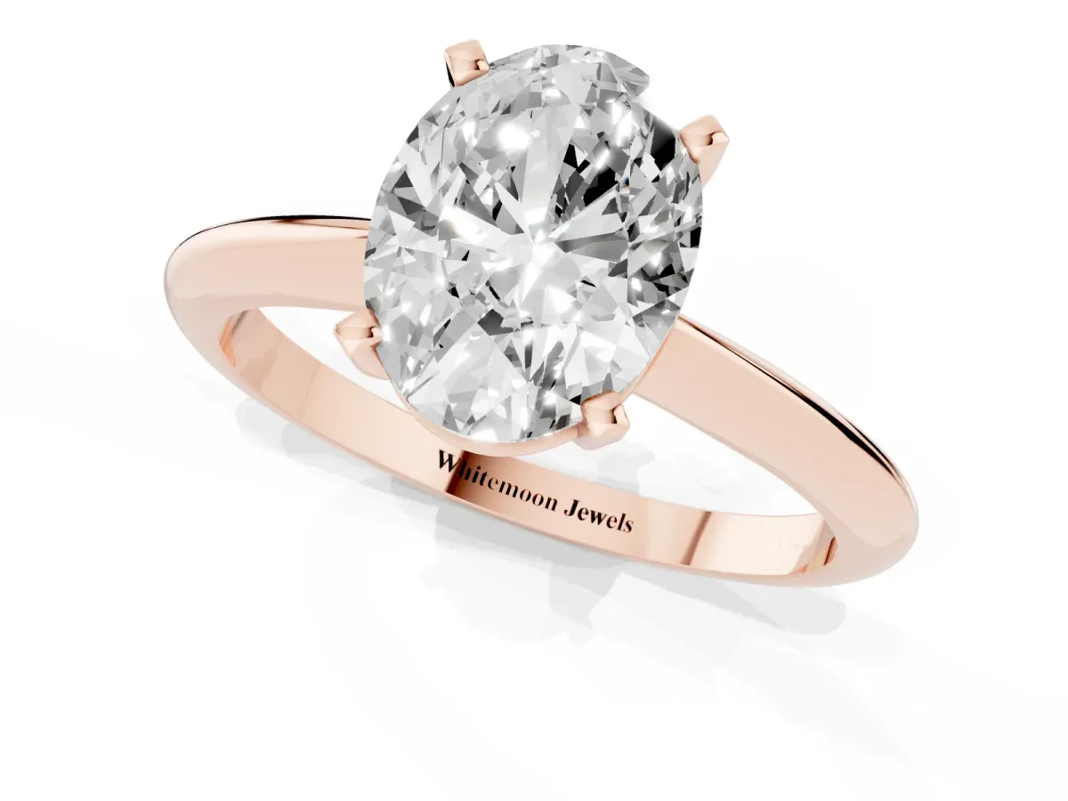 Oval Cut Cut Solitaire Ring with Four-Prong Setting on a Classic Band Rose gold