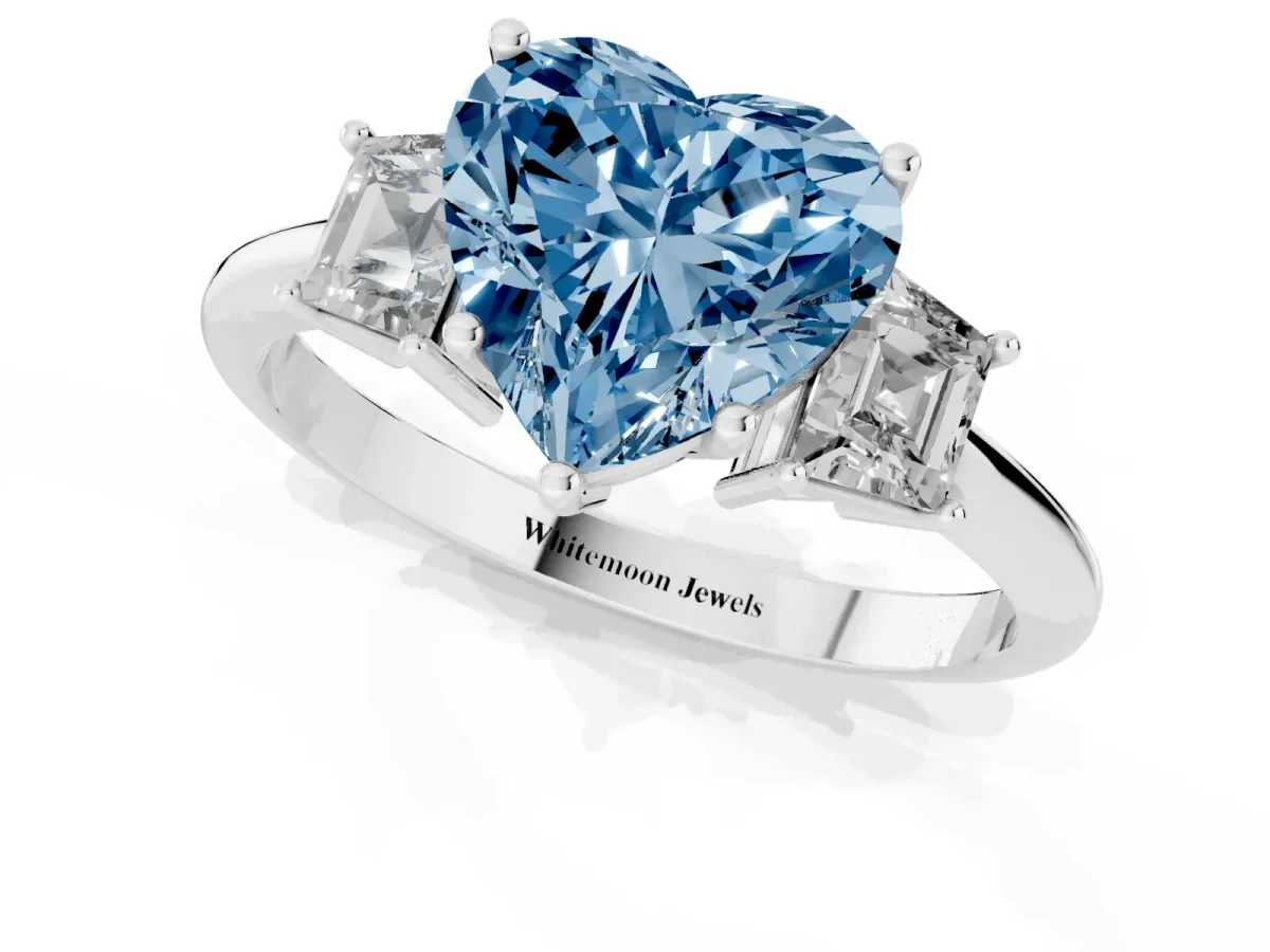 Fancy Blue Heart Cut Diamond Three-Stone Ring with Trapezoid Side Stones and Prong Setting Silver