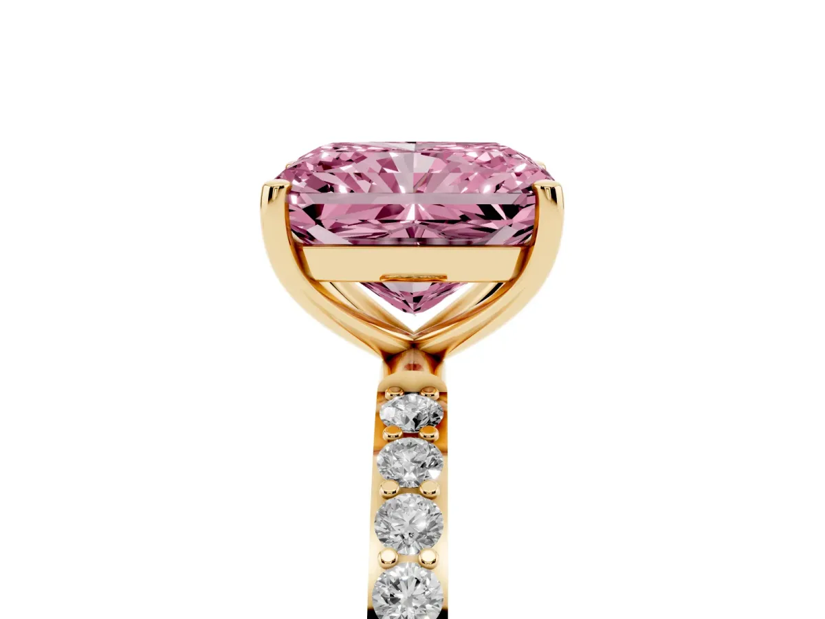 Fancy Pink Radiant Cut Diamond Solitaire Ring with Round Pavé Shoulders and Prong Setting Yellow gold