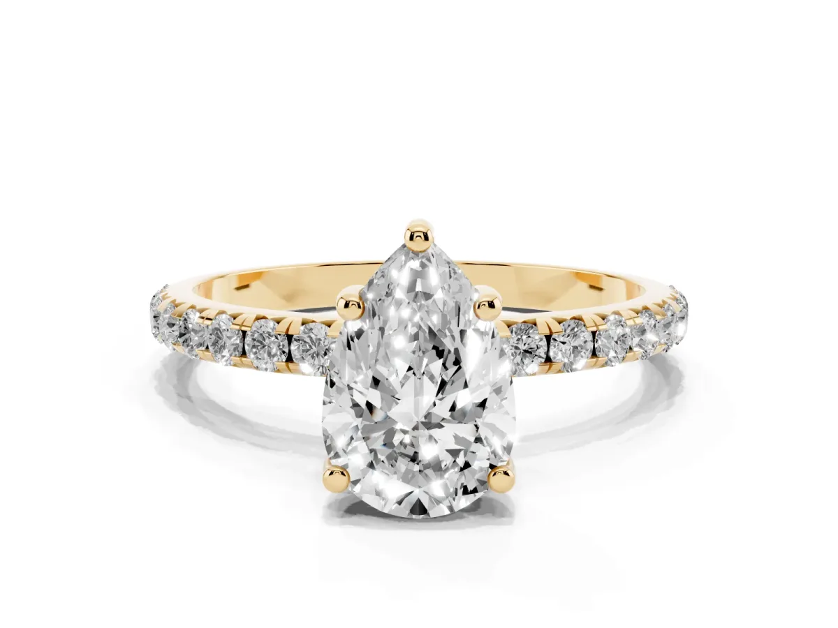 Pear Cut Cut Diamond Solitaire Ring with Micro Pave Band and Four Prong Setting Yellow gold