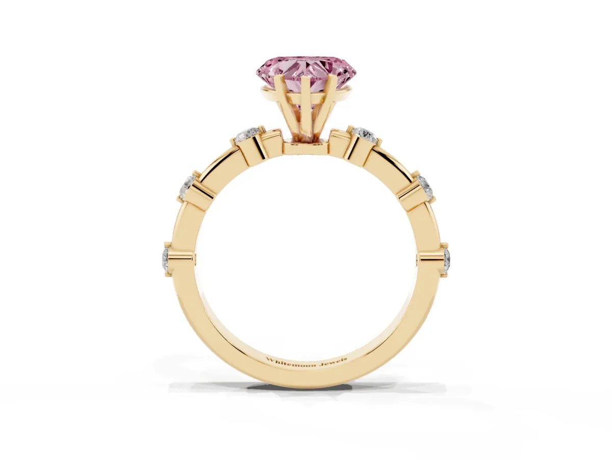 Fancy Pink Heart Cut Solitaire Diamond Ring with Bezel Set Side Stones and Prong Setting Yellow gold