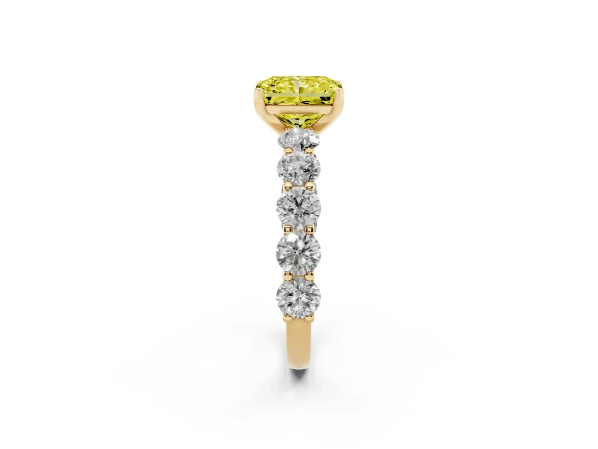 Fancy Yellow Radiant Cut Diamond Prong Setting with Side Stones on a Pave Band Yellow gold