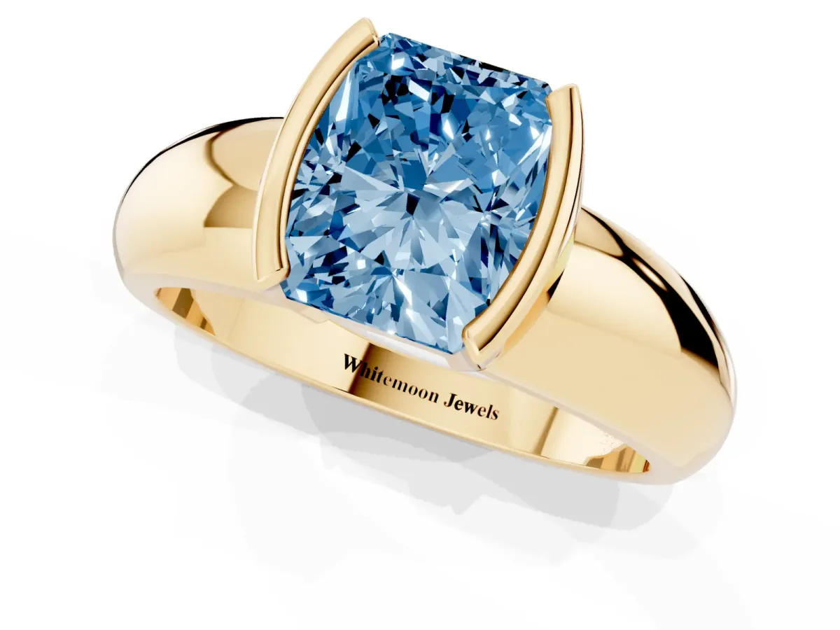 Fancy Blue Radiant Cut Solitaire Tension Set Diamond Ring with Wide Band Yellow gold