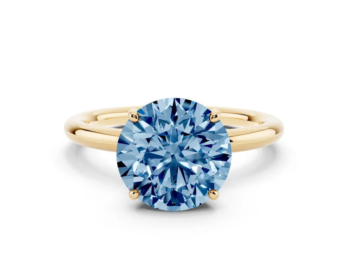 Fancy Blue Round Cut Solitaire Diamond Ring with Four-Prong Setting on a Plain Band Yellow gold