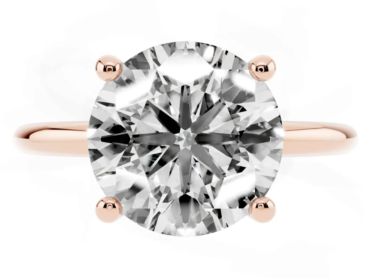 Round Cut Solitaire Diamond Ring with 4-Prong Setting on a Classic Band Rose gold