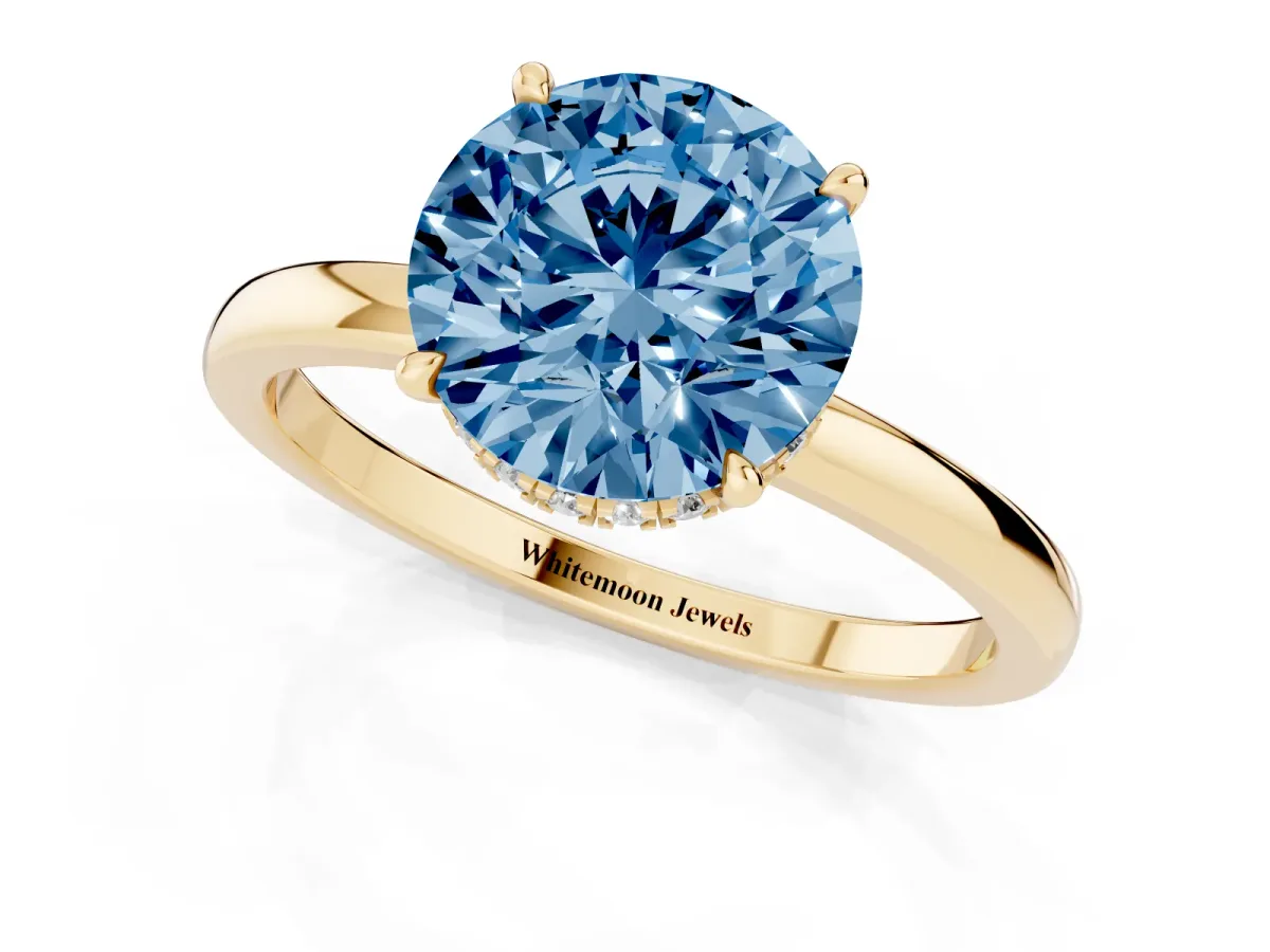 Fancy Blue Round Cut Solitaire Engagement Ring with Cathedral Band and Four-Prong Setting Yellow gold
