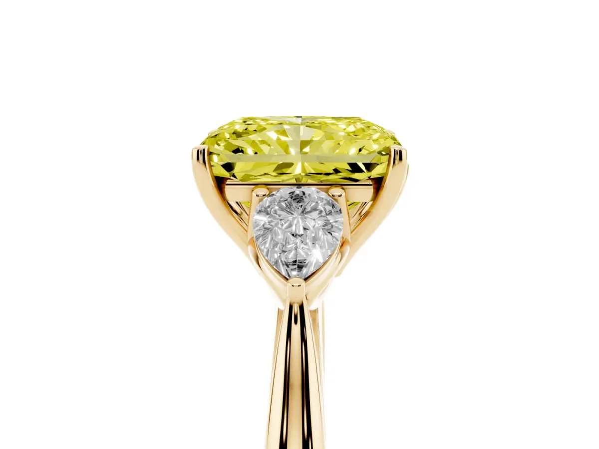 Fancy Yellow Three-Stone Radiant Cut Diamond Ring with Pear Side Stones in Four-Prong Setting Yellow gold