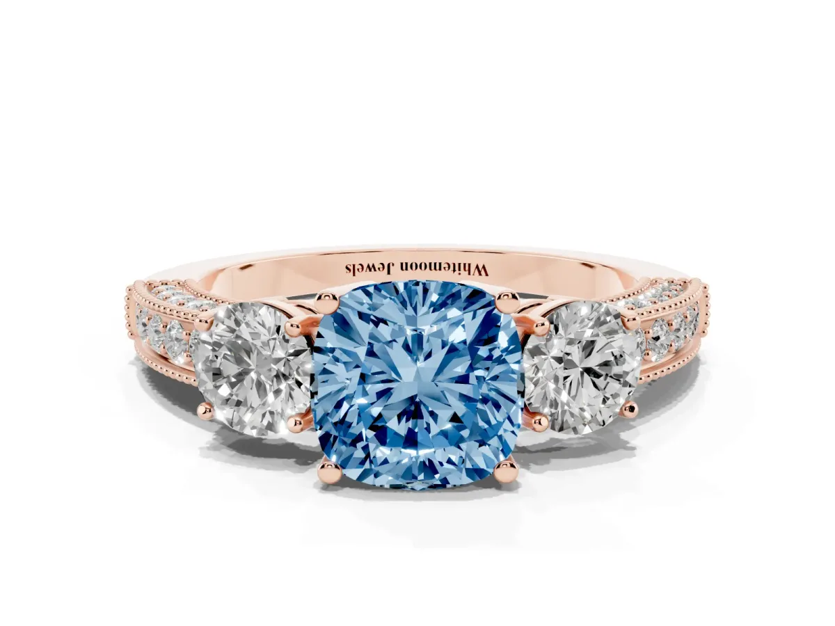 Fancy Blue Cushion Cut Three-Stone Diamond Ring with Pavé Band and Four-Prong Setting Rose gold