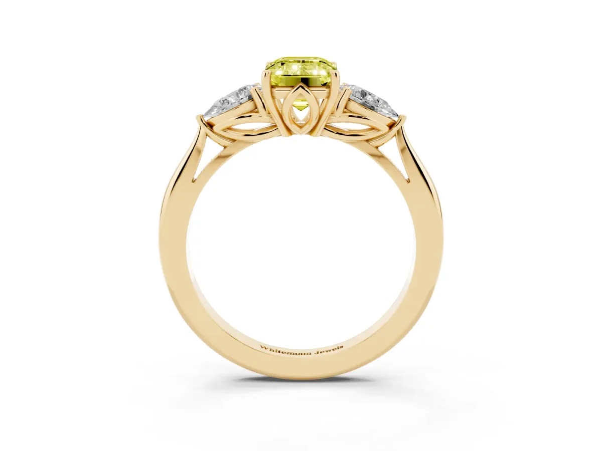 Fancy Yellow Three-Stone Emerald Cut Diamond Ring with Pear Side Stones in Four-Prong Setting Yellow gold